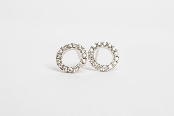 These circle studs are great to make a cool statement. There cute and funky. You can dress it up, you can wear it casually and you can match with the circle bracelet for a nice set of jewellery.   18kt white gold