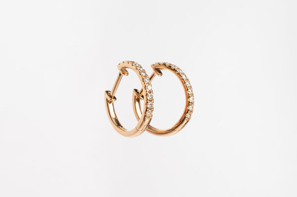 These claw set diamond hoops. A timeless setting on a modern style earrings. You will love to wear these earrings everyday.  You can wear them alone or you can stack them together with other piercings for a full look. 