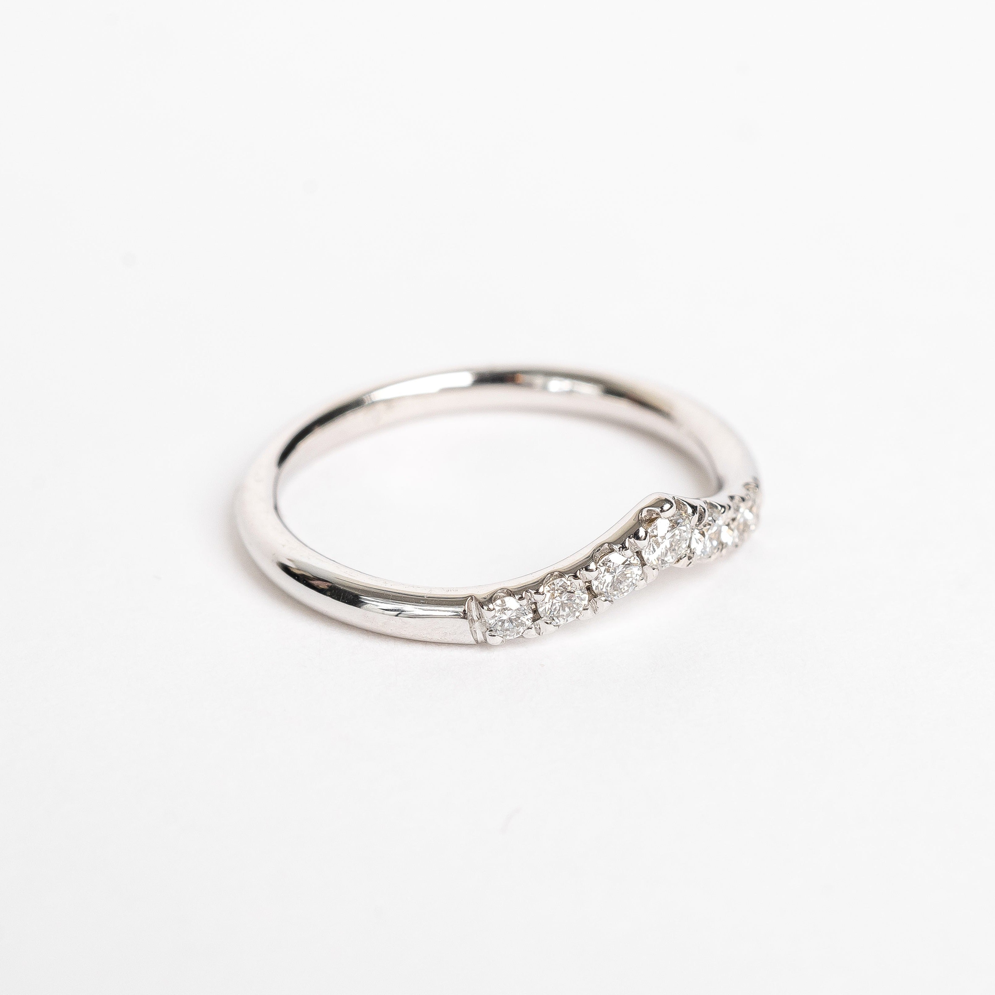 This ring has a wishbone design. The wishbone is a popular good luck symbol in the Western world. This ring is fun to stack with straight rings as it gives some funk to your ring stack.    18kt white gold