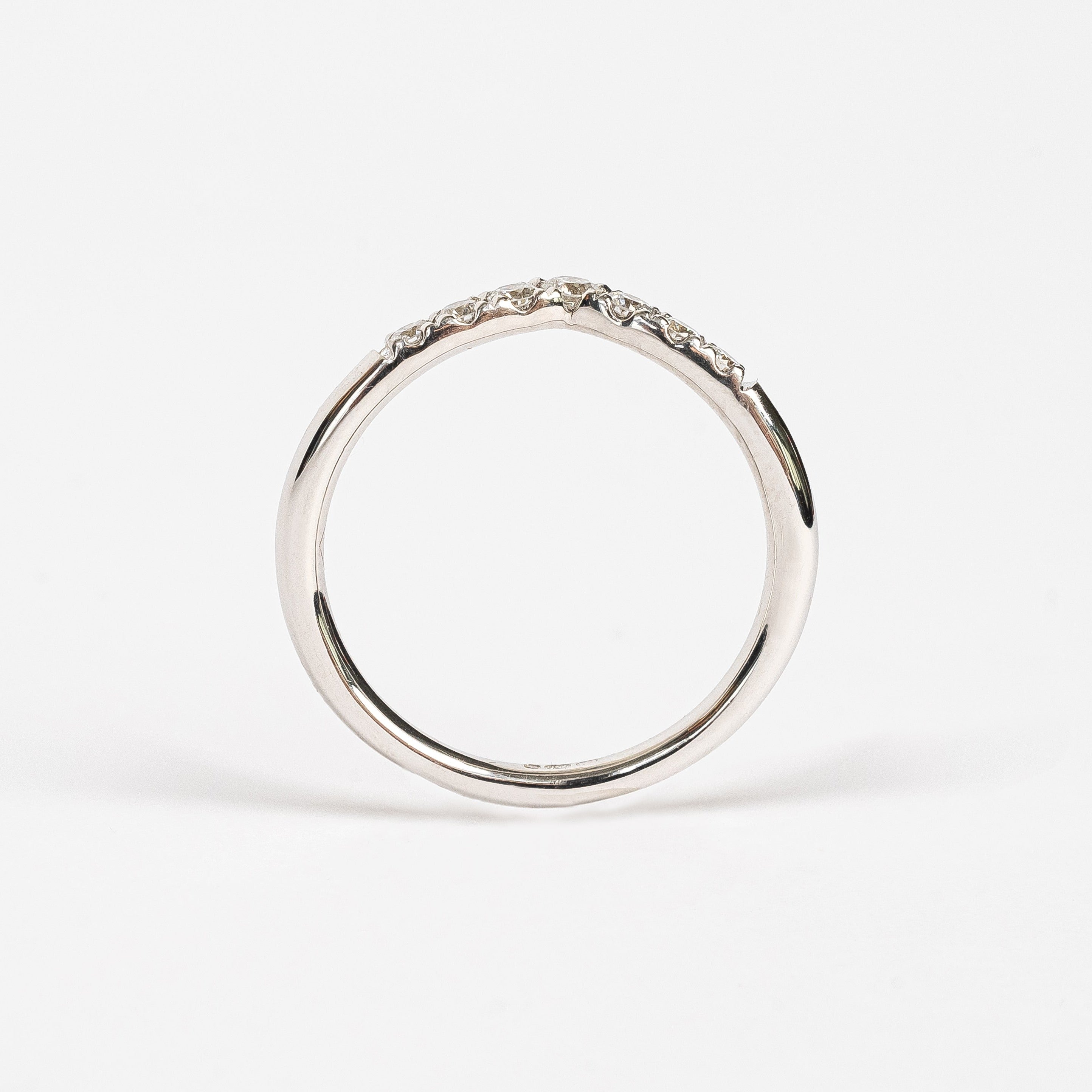 This ring has a wishbone design. The wishbone is a popular good luck symbol in the Western world. This ring is fun to stack with straight rings as it gives some funk to your ring stack.    18kt white gold