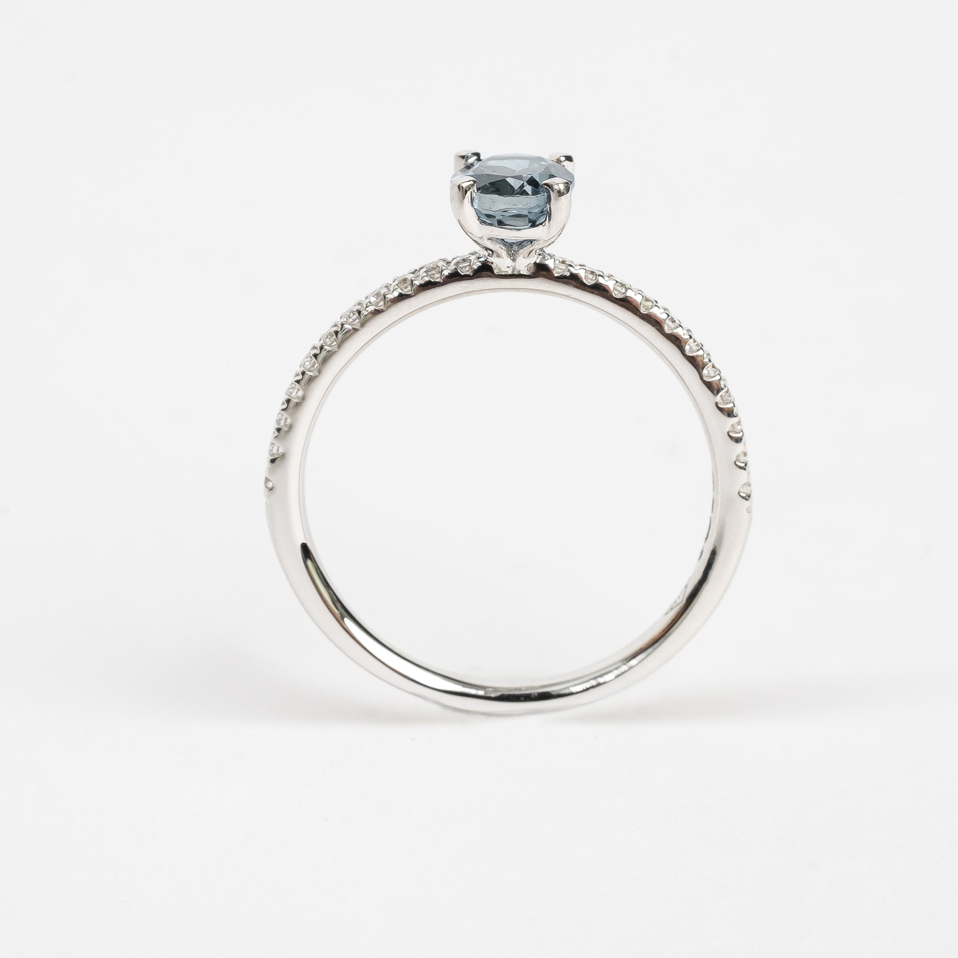 This ring is so beautiful and adds a pop of color to your look. The diamonds set on the band create extra sparkle and honours the oval cut London Topaz.