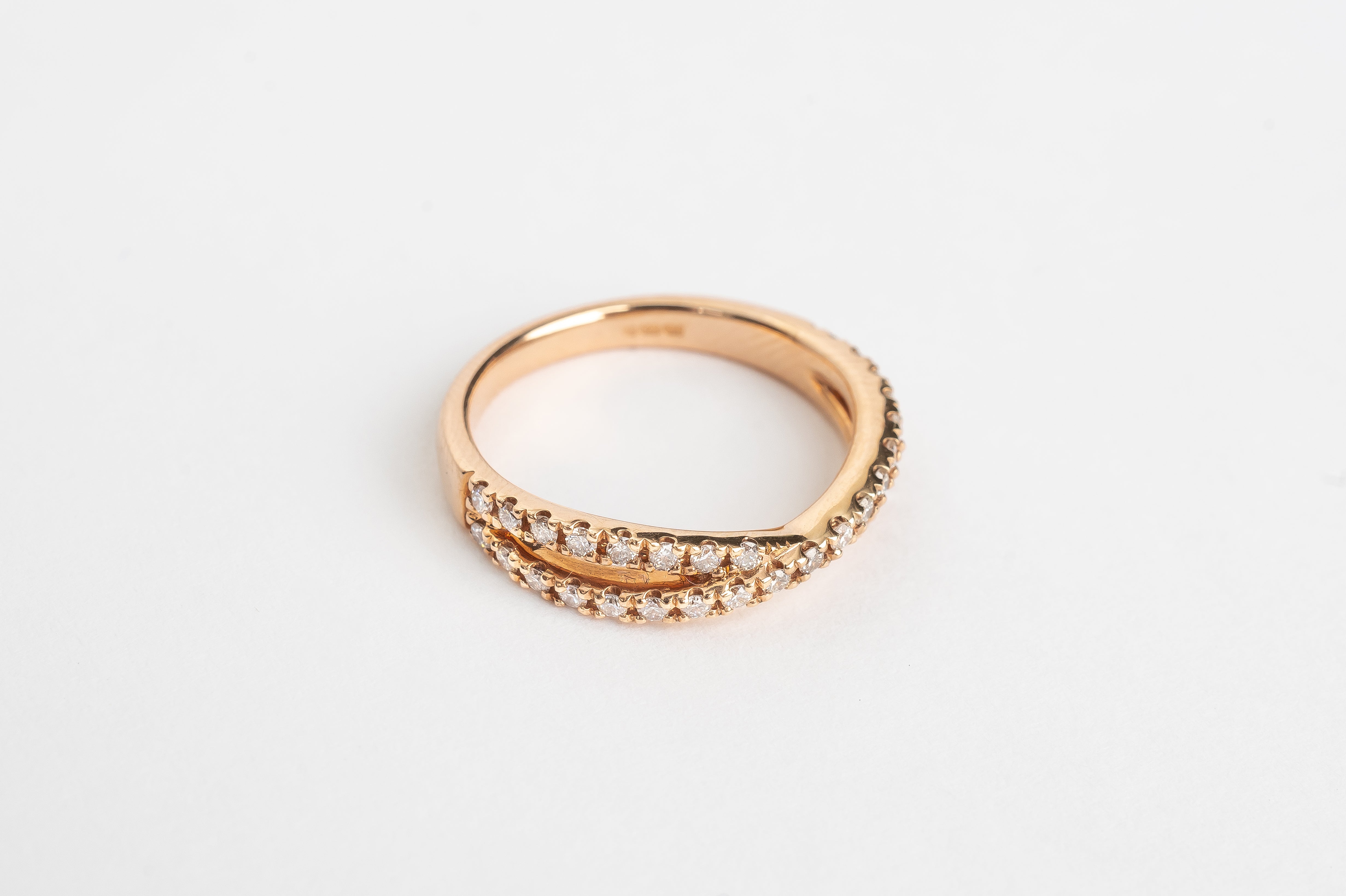 Color_yellow-goldThis cross over ring is made out of one band splitting into two diamond set bands and crossing in the middle. It is stunning! This ring can be worn alone or stacked together with others. What's your style?   18kt rose gold yellow