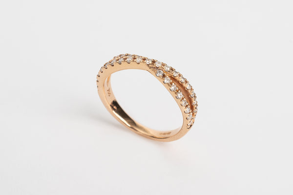 Color_yellow-goldThis cross over ring is made out of one band splitting into two diamond set bands and crossing in the middle. It is stunning! This ring can be worn alone or stacked together with others. What's your style?   18kt rose gold