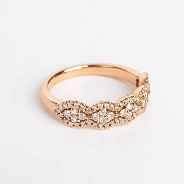 This waved fancy ring has a fancy romantic look. The placement of the stones can remind you from beautiful lace. The stones wave each time around 4 round brilliant stones set in a rhombus in the middle.   18kt rose gold