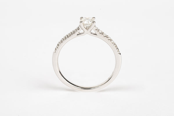 This white gold diamond ring is set with diamonds over half the band. This ring is a classic and precious design. We also have this ring available without the diamonds on the band if you are look for something even more timeless.