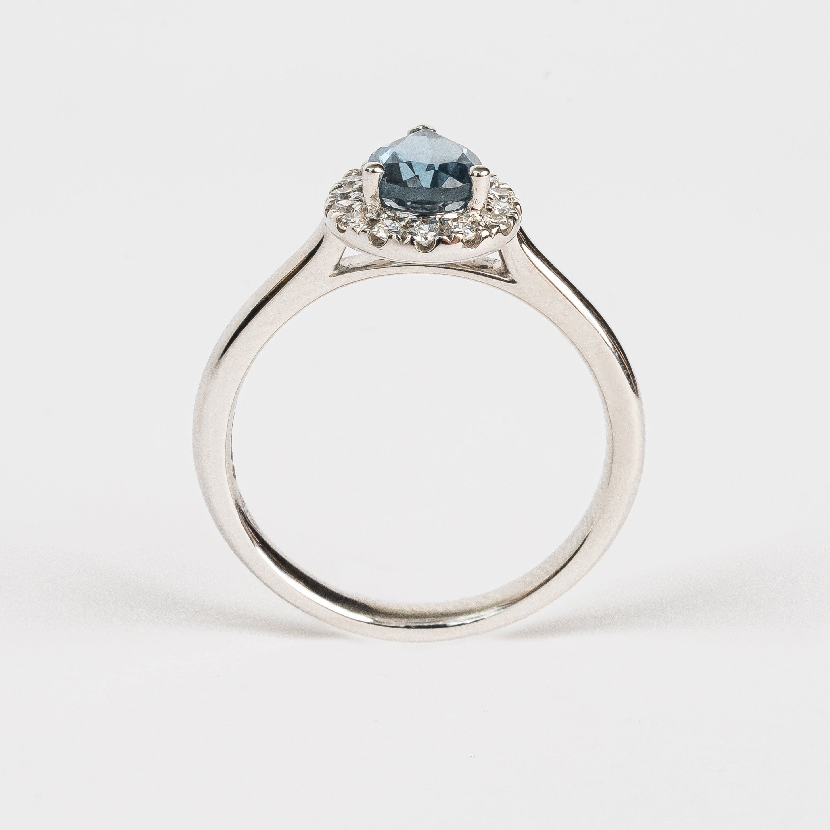 This white golden ring with a pear cut London blue Topaz gemstone in the center surrounded by a pear shaped halo. This ring is stunning!  It has a classic vibe because but it's in so many ways a modern style. Did you know a pear cut is the most wanted fancy shape.