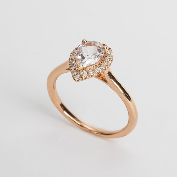 This rose golden ring with a pear cut pink Morganite is surrounded by a beautiful pear shaped diamond halo.   This ring looks so soft and feminine.   Pear cut is the most wanted fancy shape.