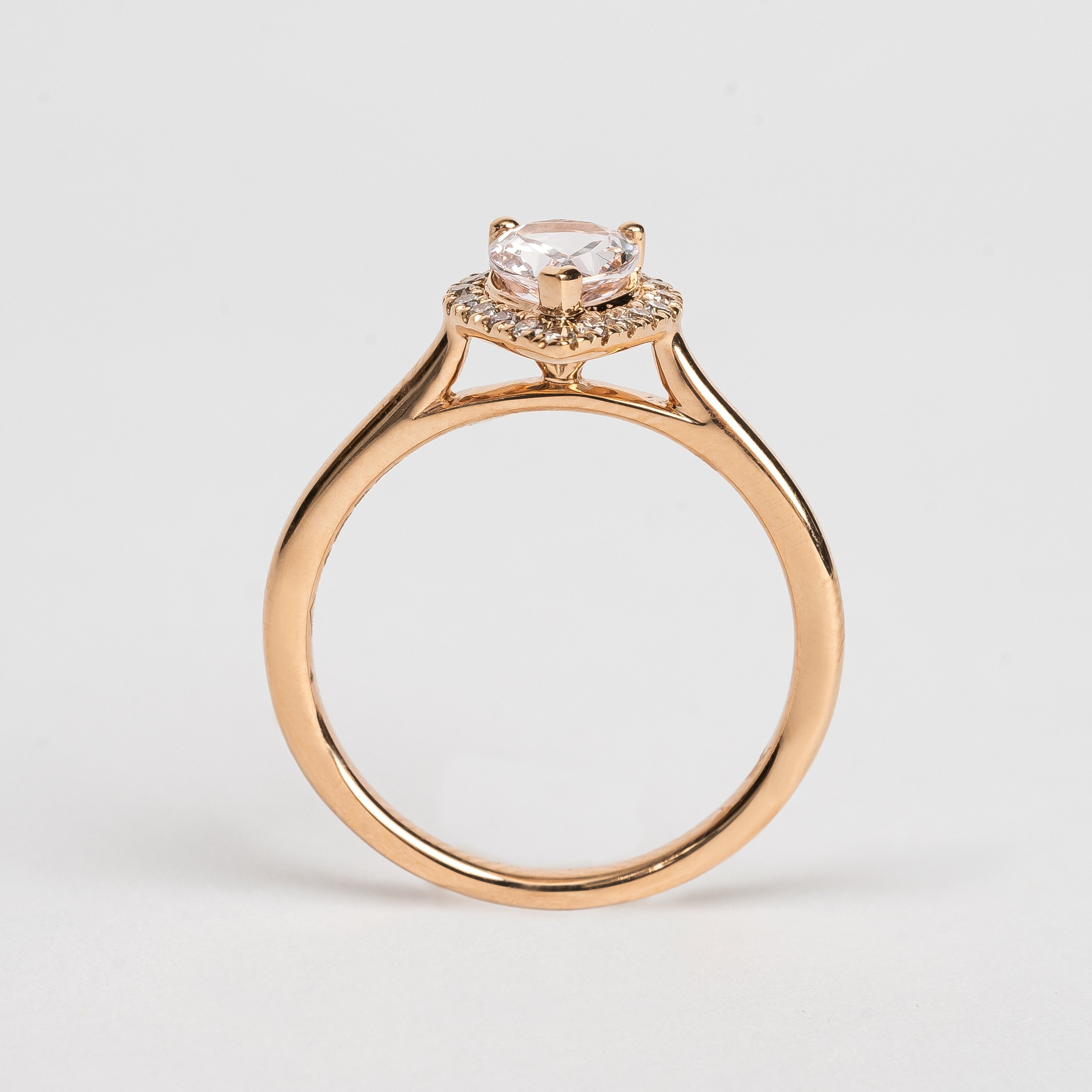 This rose golden ring with a pear cut pink Morganite is surrounded by a beautiful pear shaped diamond halo.   This ring looks so soft and feminine.   Pear cut is the most wanted fancy shape.