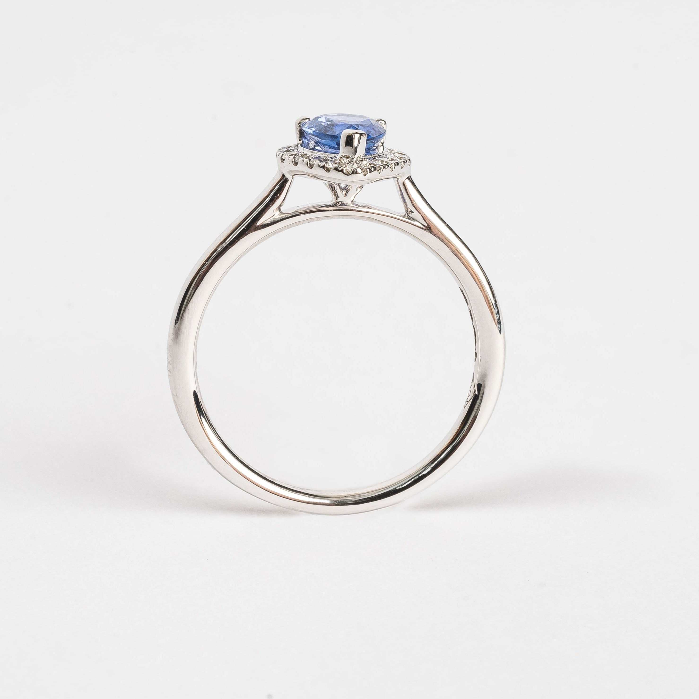 This white golden ring with a pear cut blue Sapphire is timeless. The blue Sapphire is surrounded by a halo of diamonds. The blue of the Sapphire and the white metal color match perfectly together.   The blue Sapphire gives your look a nice pop of color.   The pear cut is the most wanted fance shape.