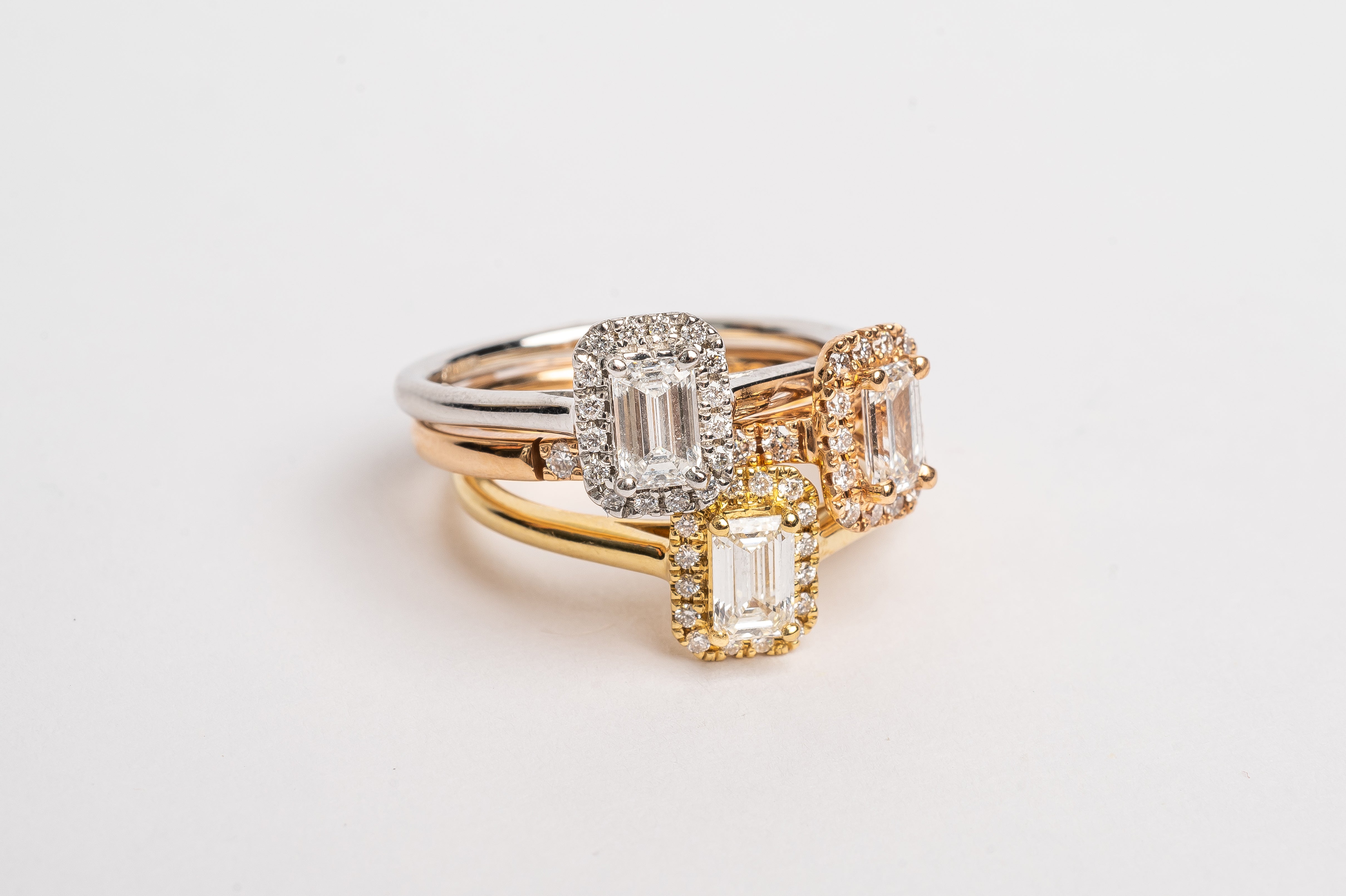 This gorgeous emerald cut Morganite ring made of rose gold is so pretty. The band is set with diamonds and the Marganite emerald cut is surround by a diamond halo. This fancy shape Morganite gemstone is pink. The rose gold and the pink Morganite are a true match.   18kt rose gold 