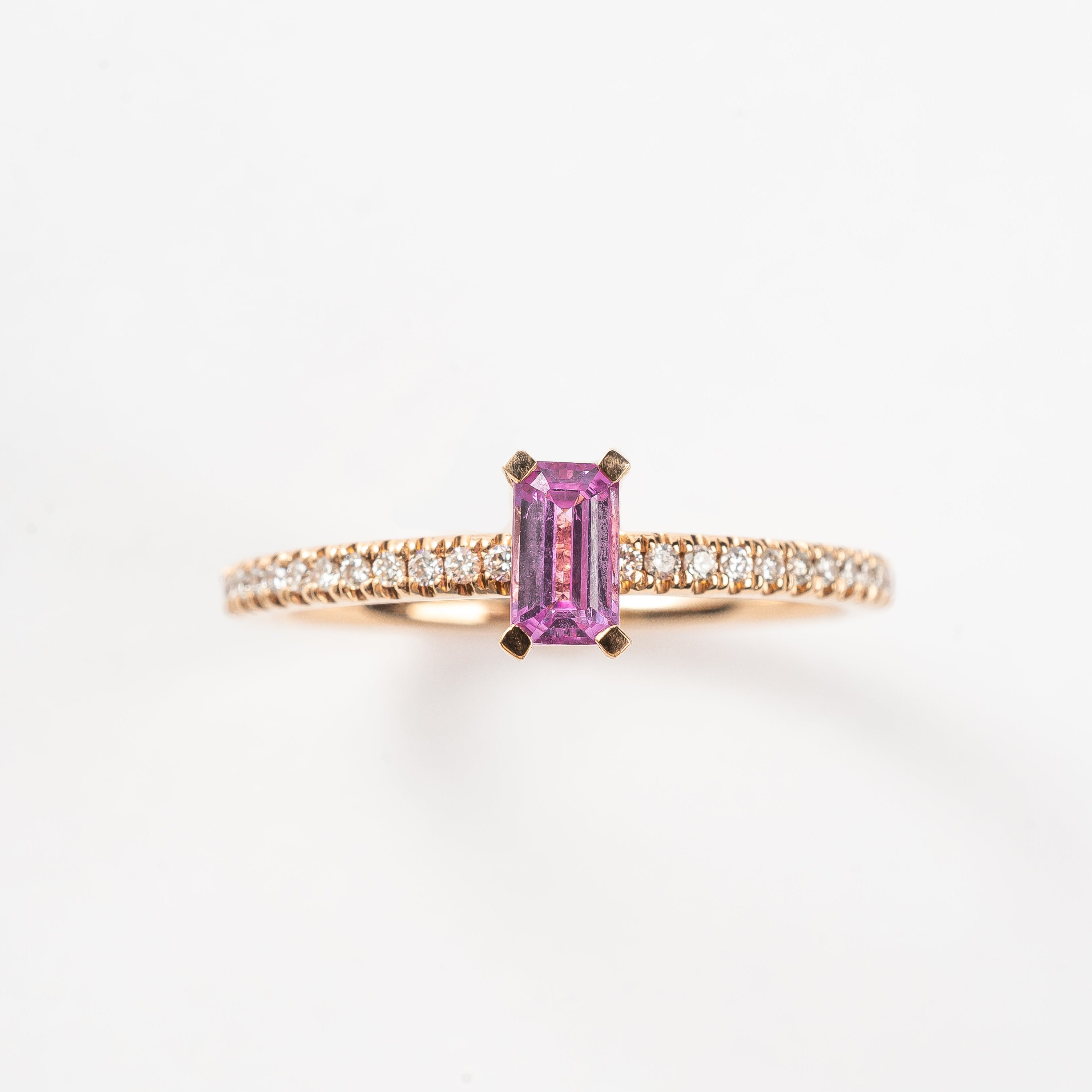 This most beautiful pink Sapphire is so cute and makes you instant smile when looking at it. It's perfect for that pop of color to your look. The rose golden band is set with diamonds to compliment this pink Sapphire.   18kt rose gold