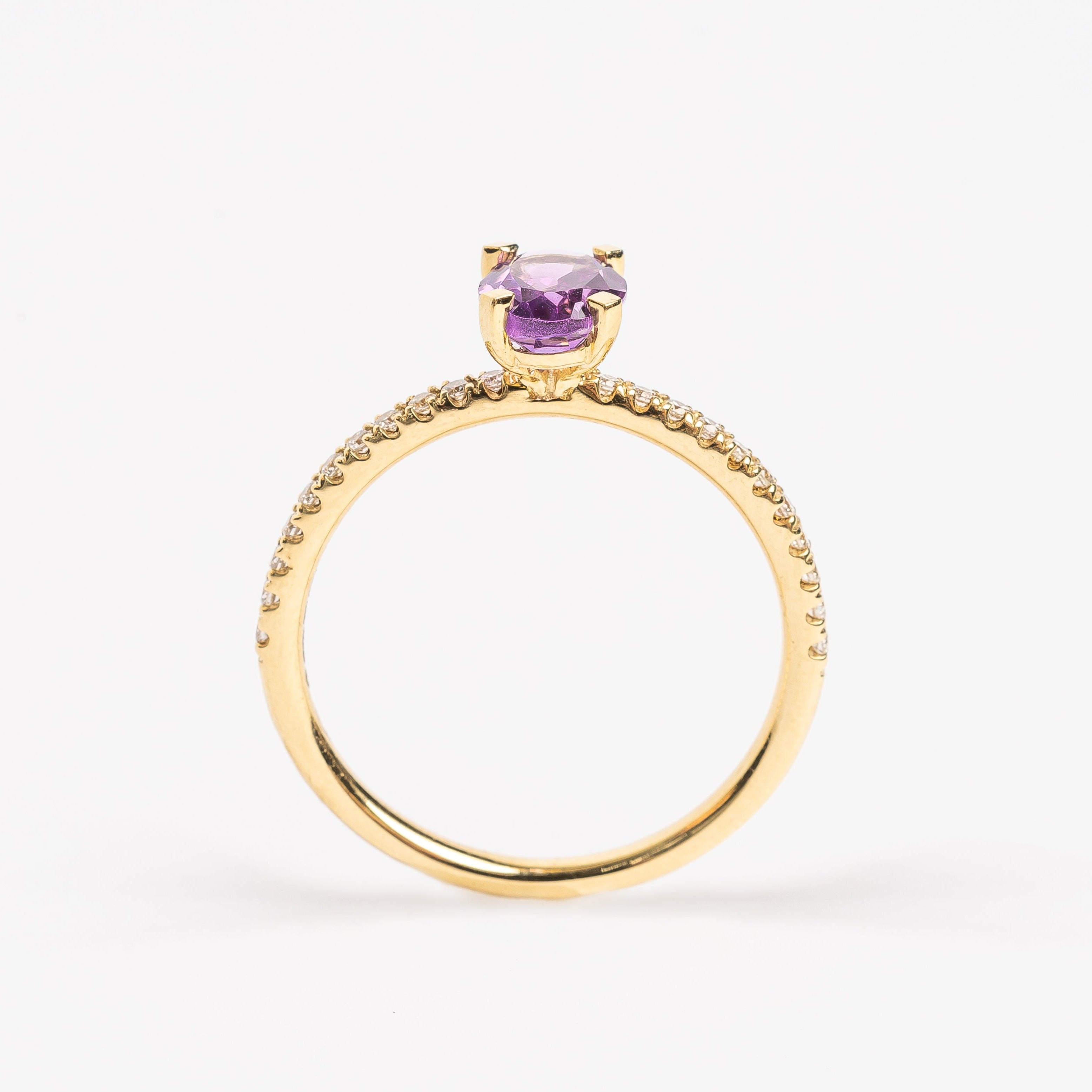 This pretty lilac oval cut Amethyst ring gives your look sparkle and color. It looks so nice and many will notice this pop of lilac on your hand. This lilac Amethyst matches very well with the yellow golden band.   18kt yellow gold