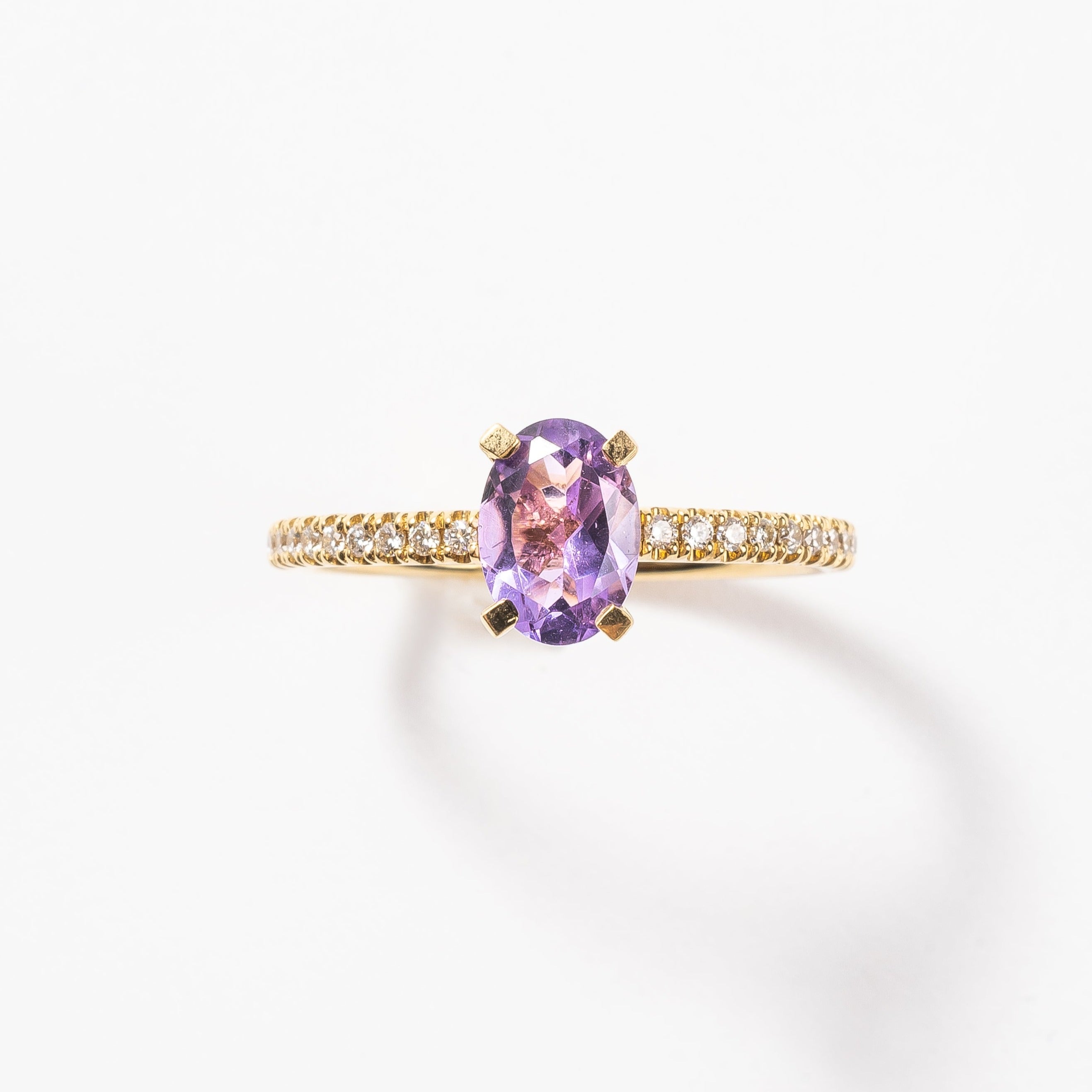 This pretty lilac oval cut Amethyst ring gives your look sparkle and color. It looks so nice and many will notice this pop of lilac on your hand. This lilac Amethyst matches very well with the yellow golden band.   18kt yellow gold