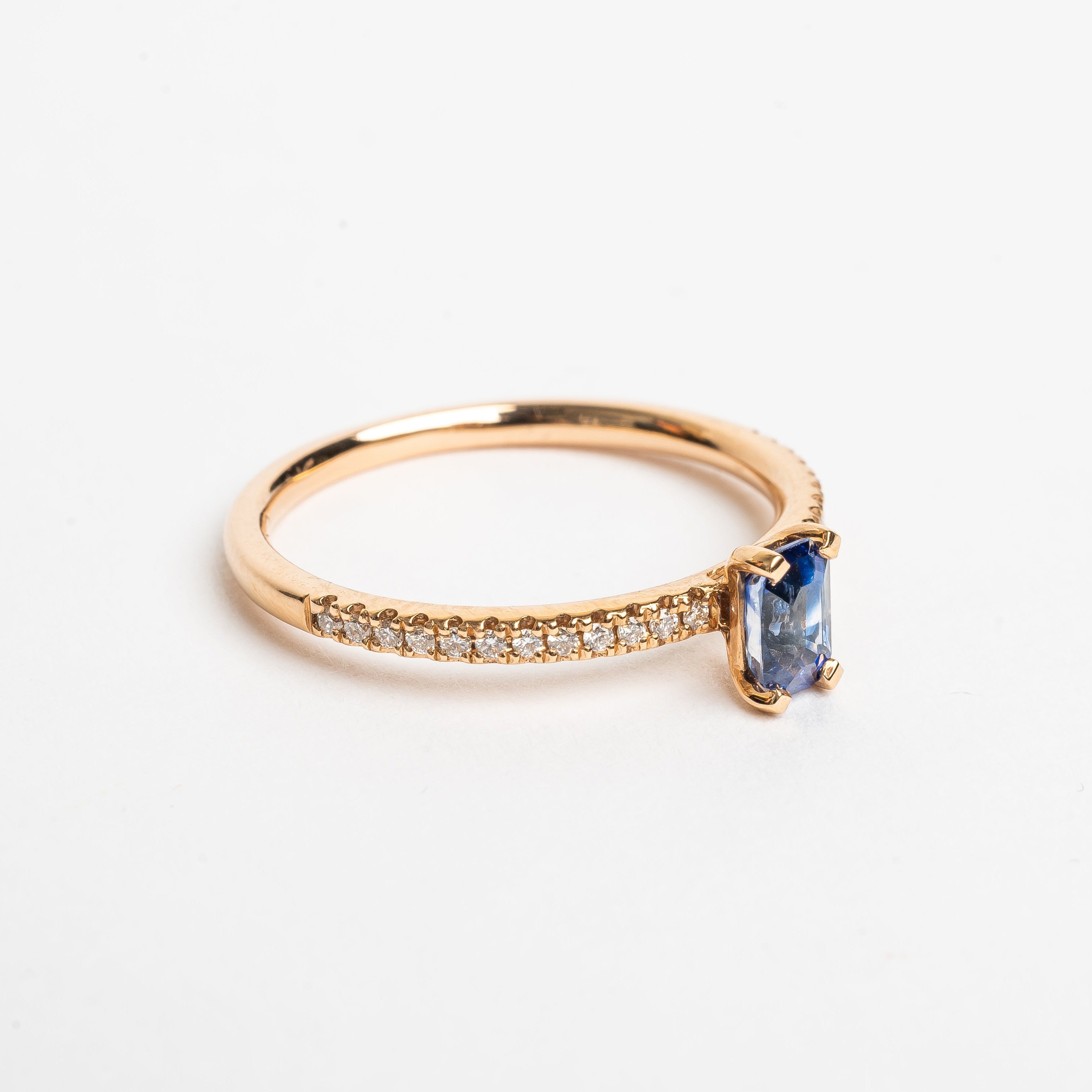 This most beautiful blue Sapphire is so cute and makes you instant smile when looking at it. It's perfect for that pop of color to your look. The rose golden band is set with diamonds to compliment this blue Sapphire. 