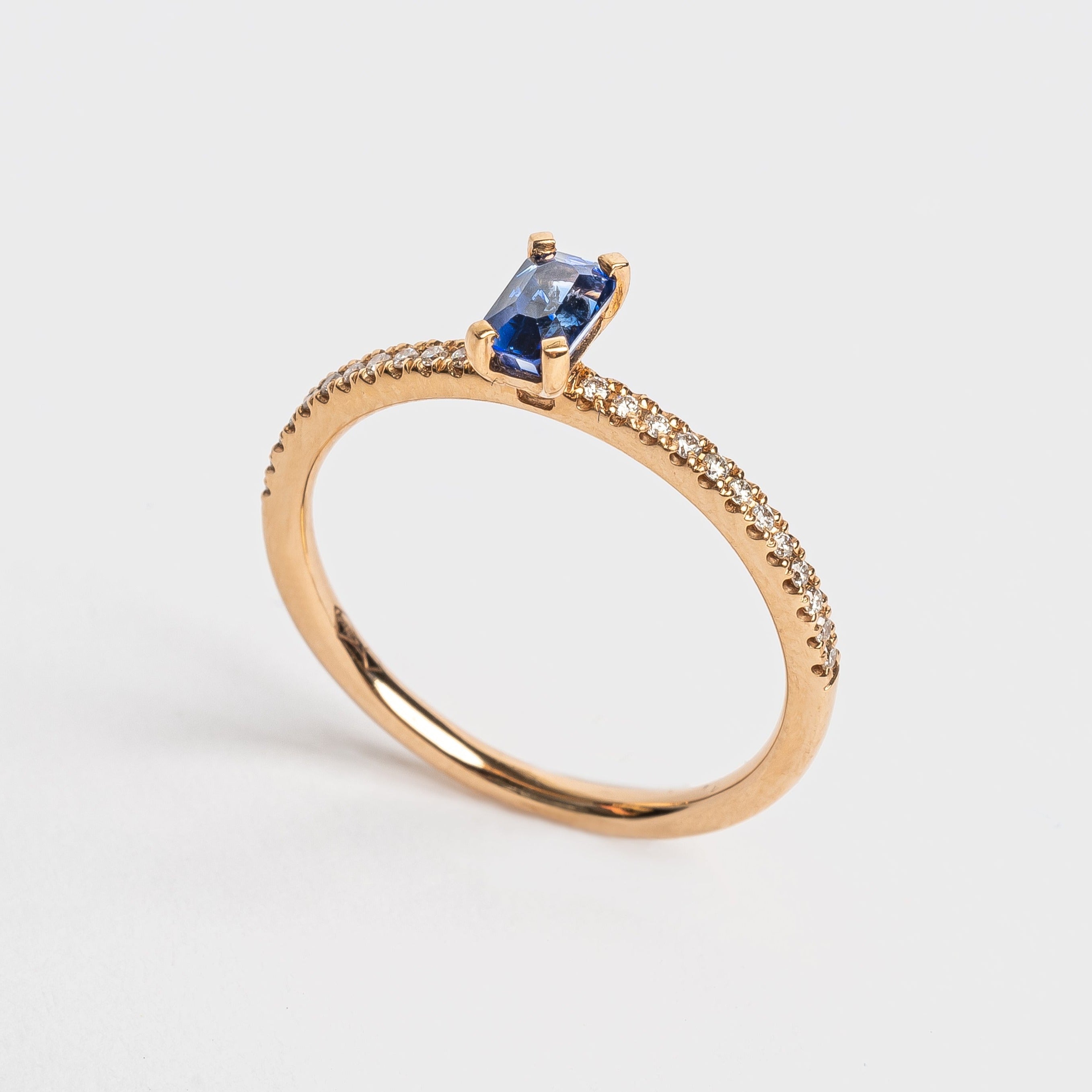 This most beautiful blue Sapphire is so cute and makes you instant smile when looking at it. It's perfect for that pop of color to your look. The rose golden band is set with diamonds to compliment this blue Sapphire. 