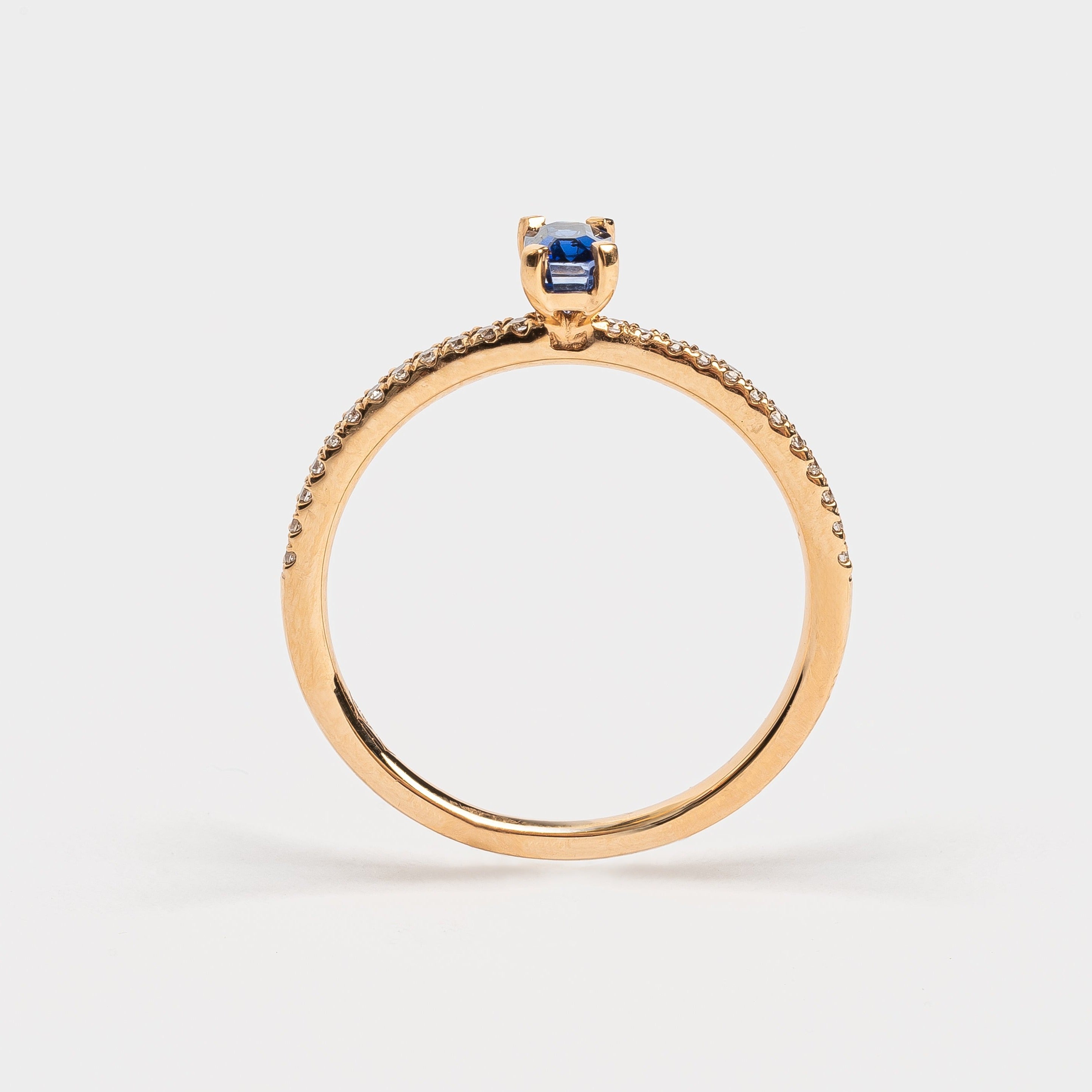 This most beautiful blue Sapphire is so cute and makes you instant smile when looking at it. It's perfect for that pop of color to your look. The rose golden band is set with diamonds to compliment this blue Sapphire. 