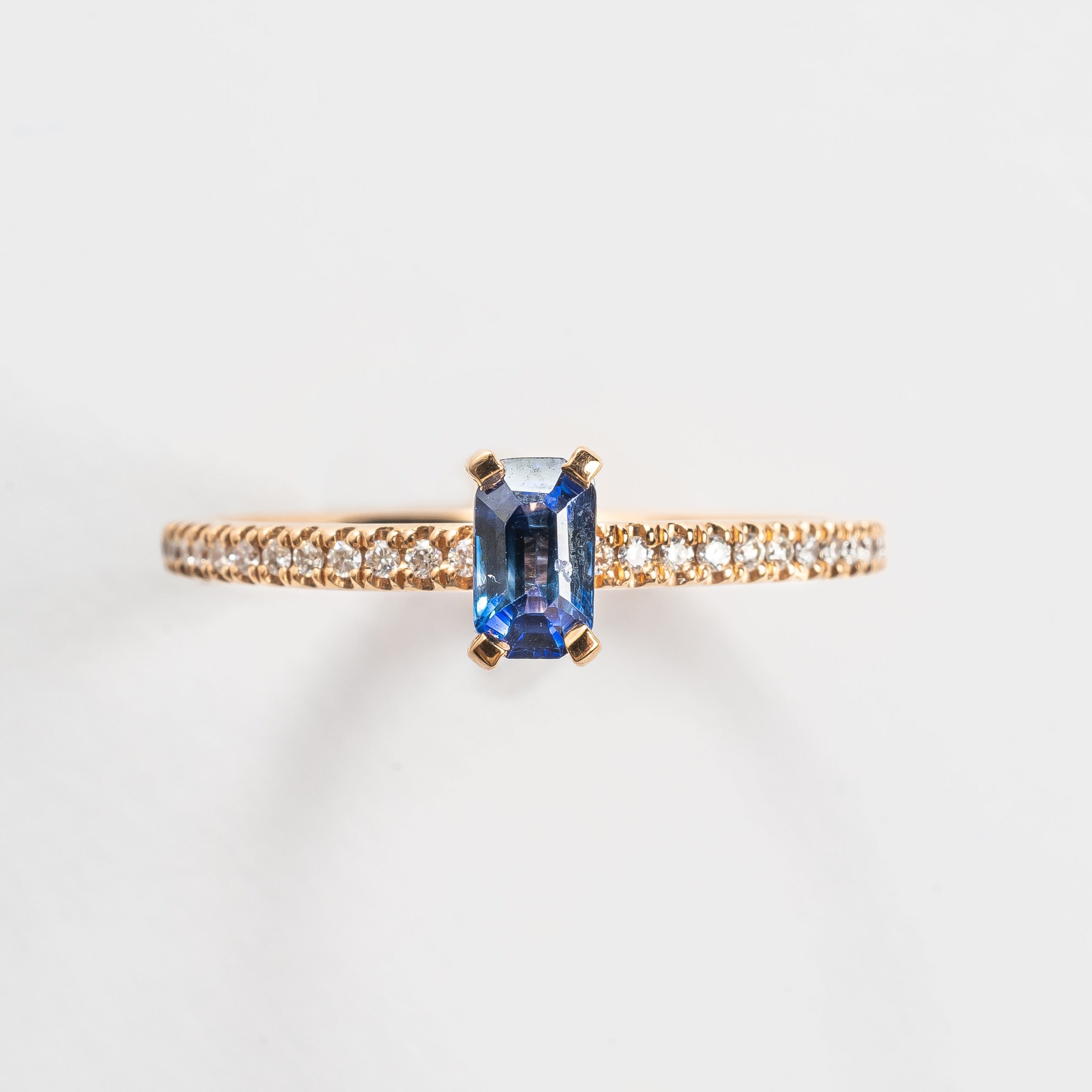 This most beautiful blue Sapphire is so cute and makes you instant smile when looking at it. It's perfect for that pop of color to your look. The rose golden band is set with diamonds to compliment this blue Sapphire. 