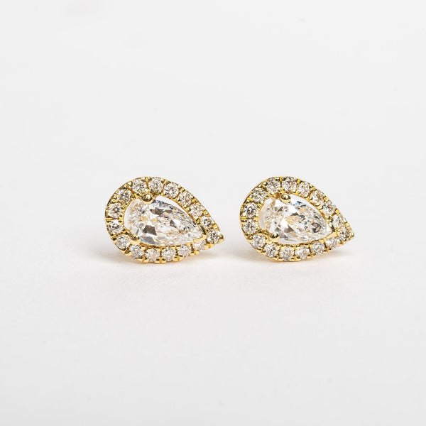 A pear is the most sold fancy shape on the market, they are hot. These pear cut diamond and diamonds halo studs are pretty and fit on all ears. 