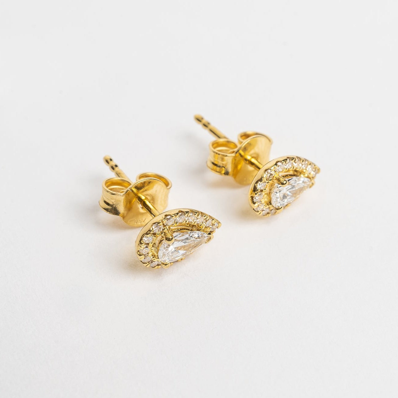 A pear is the most sold fancy shape on the market, they are hot. These pear cut diamond and diamonds halo studs are pretty and fit on all ears. 