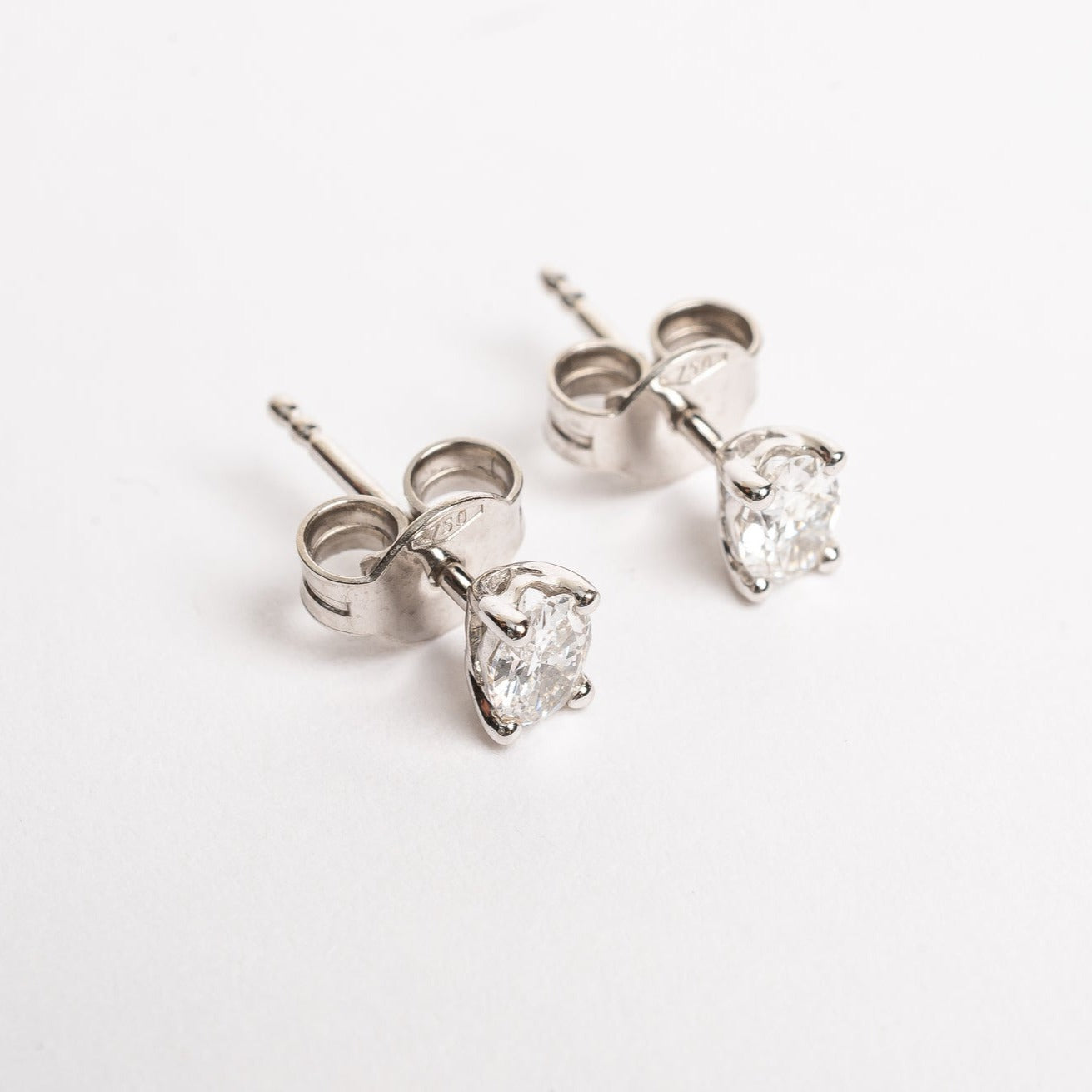 These beautiful oval diamond studs compliment your look. Many will buy these studs as a first diamond pair earrings. Some will go for round but these are oval shaped which makes it more special.   These studs are also cool to combine with an extra piercing. People will notice these diamond beauties. 