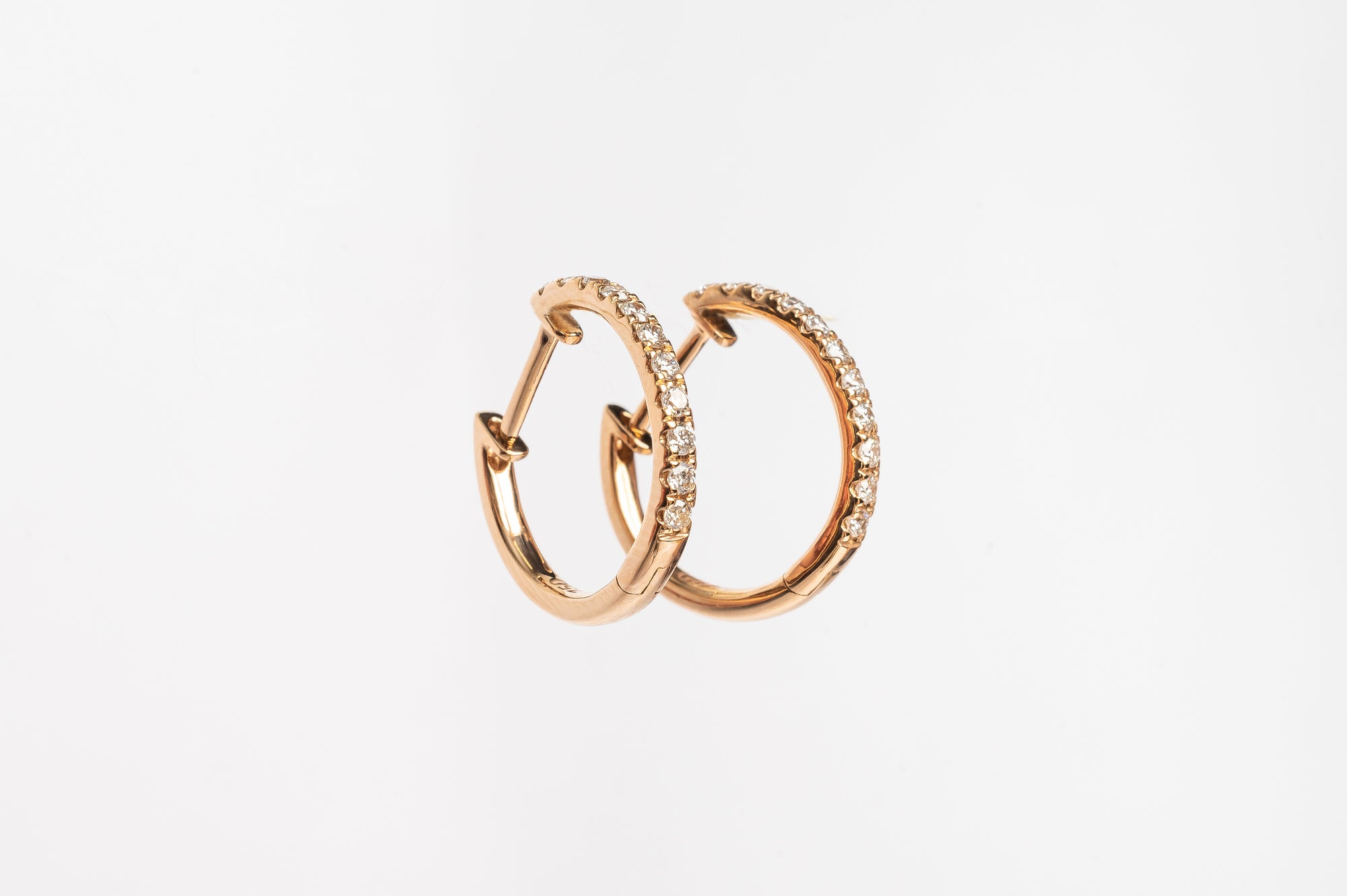 These claw set diamond hoops. A timeless setting on a modern style earrings. You will love to wear these earrings everyday.  You can wear them alone or you can stack them together with other piercings for a full look. 