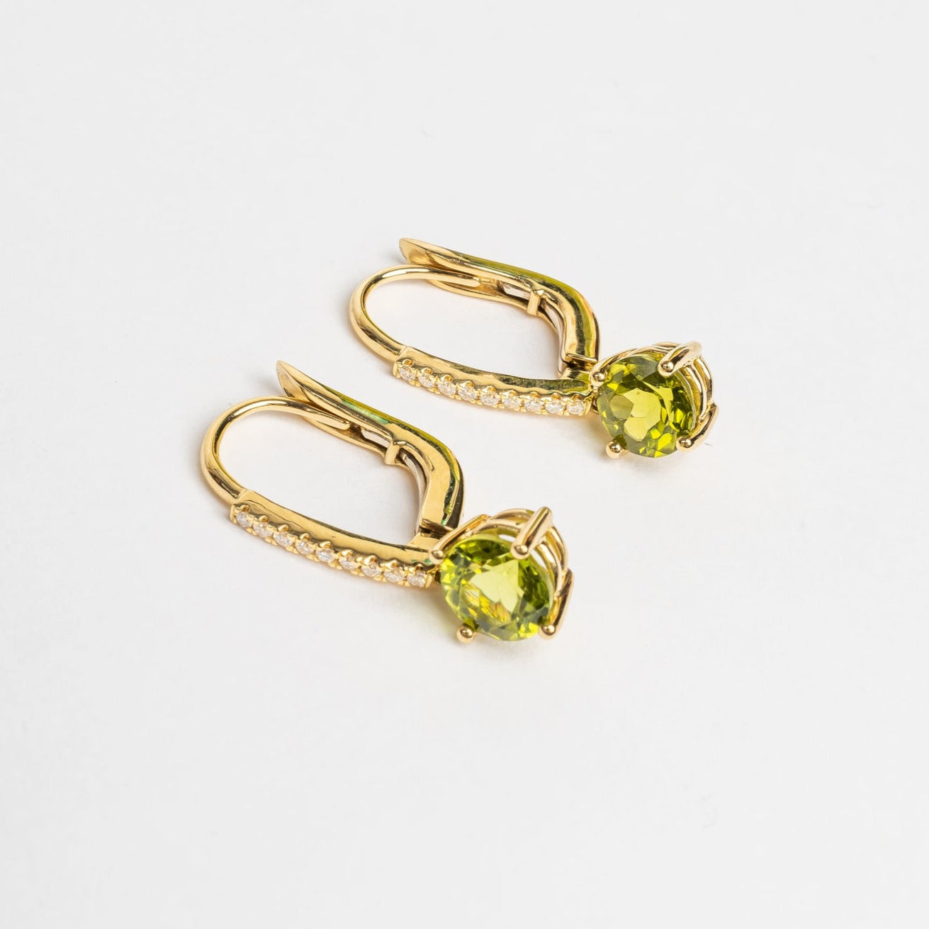 Beautiful green earrings, matching your modern outfits. The green compliments most when you have brown or greenish eyes. These earrings are so beautiful, they won't stay unnoticed. 