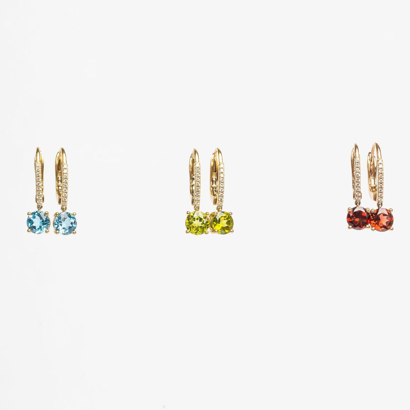 Beautiful green earrings, matching your modern outfits. The green compliments most when you have brown or greenish eyes. These earrings are so beautiful, they won't stay unnoticed.  I have these earrings made with swiss topaz, peridot and red garnet. Which one are you going to buy?