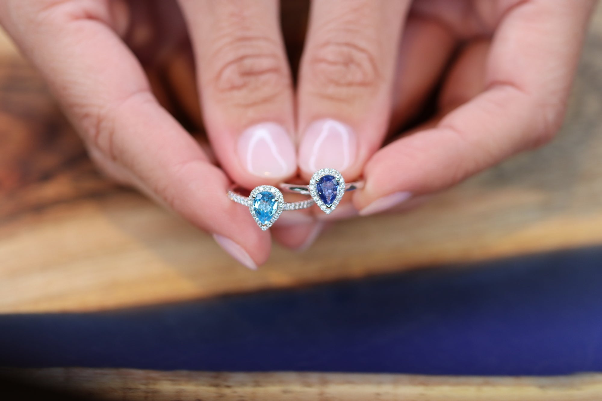 This white golden ring with a pear cut blue Sapphire is timeless. The blue Sapphire is surrounded by a halo of diamonds. The blue of the Sapphire and the white metal color match perfectly together.   The blue Sapphire gives your look a nice pop of color.   The pear cut is the most wanted fance shape. Comparison between Blue Sapphire and Swiss Topaz.