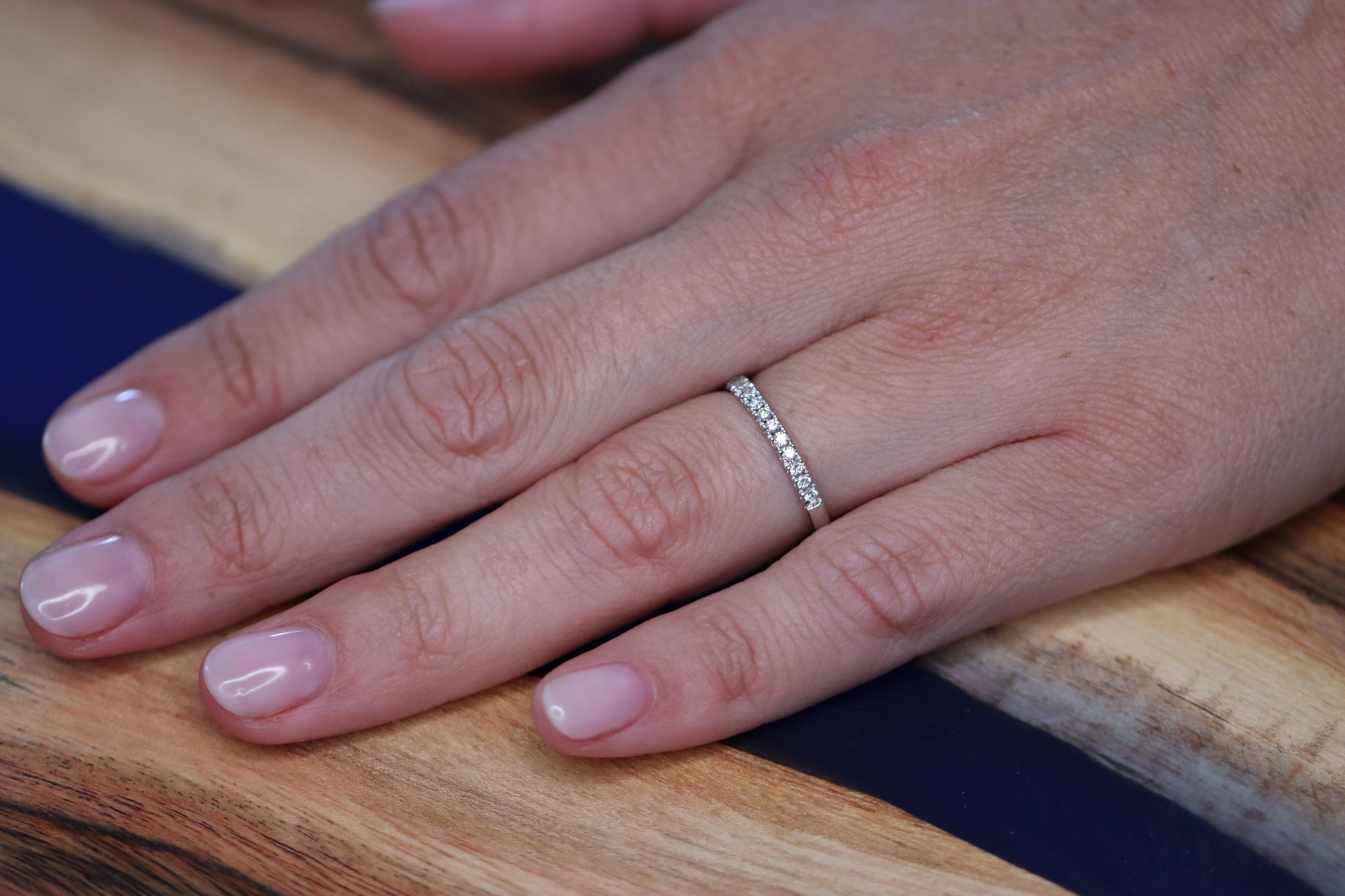 This beautiful eternity ring is 50 % set with diamonds. Every diamond is set with 4 claws, these diamonds are not going anywhere. The claws between every diamond and the diamonds itself make the ring sparkle from every side. It's a beautiful addition to your stack, can be worn as a wedding ring next to and engagement ring or alone on any finger.