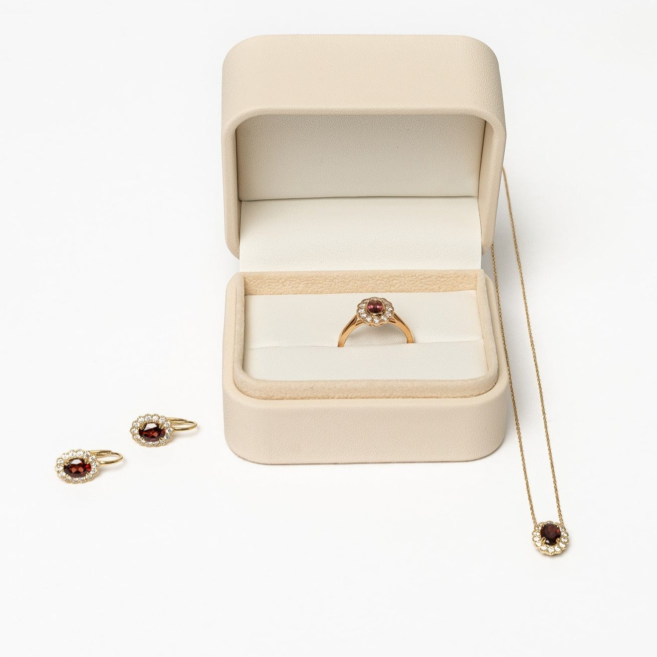 This elegant ring is set with beautiful natural diamonds and with an oval cut red garnet. The ring is made from 18kt rose gold.   From this gorgeous style we have created a matching necklace and earrings. You can find them in our webshop too when you filter on red garnet or colored gemstone styles. 