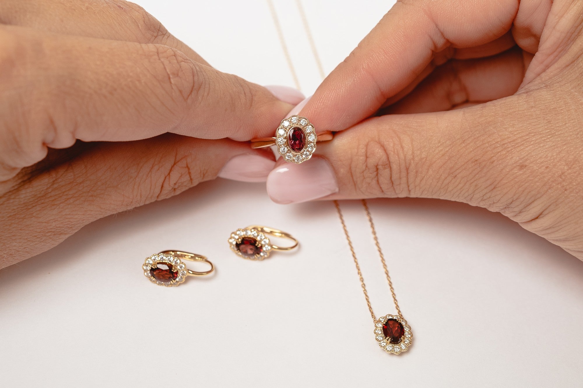 This elegant necklace is set with beautiful natural diamonds and with an oval cut red garnet. The necklace is made from 18kt rose gold.  From this gorgeous style we have created a matching ring and earrings. You can find them in our webshop when you filter on red garnet or colored gemstone styles. 