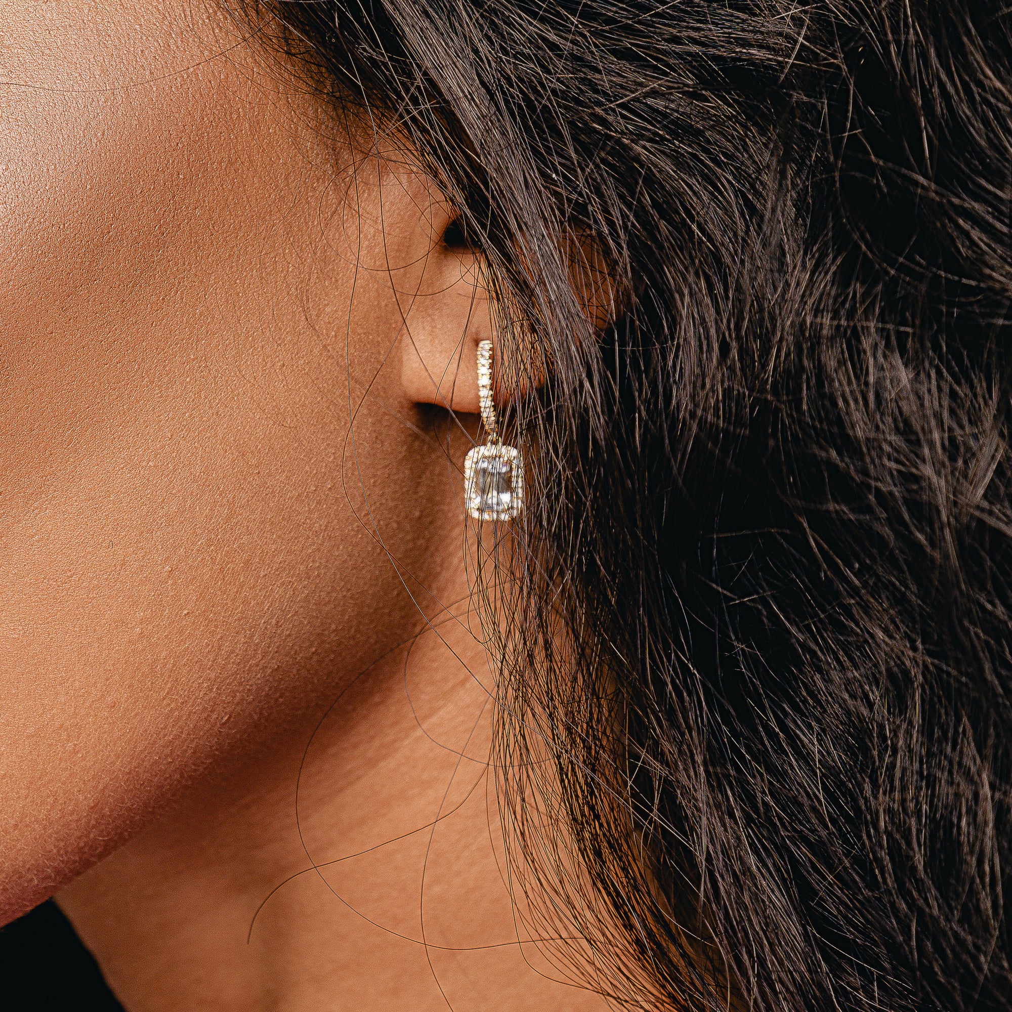 These beautiful pendant earrings with a blue Emerald cut Aquamarine center stone are elegant and finish every look.  The blue makes you happy and compliment your eyes.   18kt yellow gold  6mm x 4mm Emerald cut blue Aquamarine each earring 